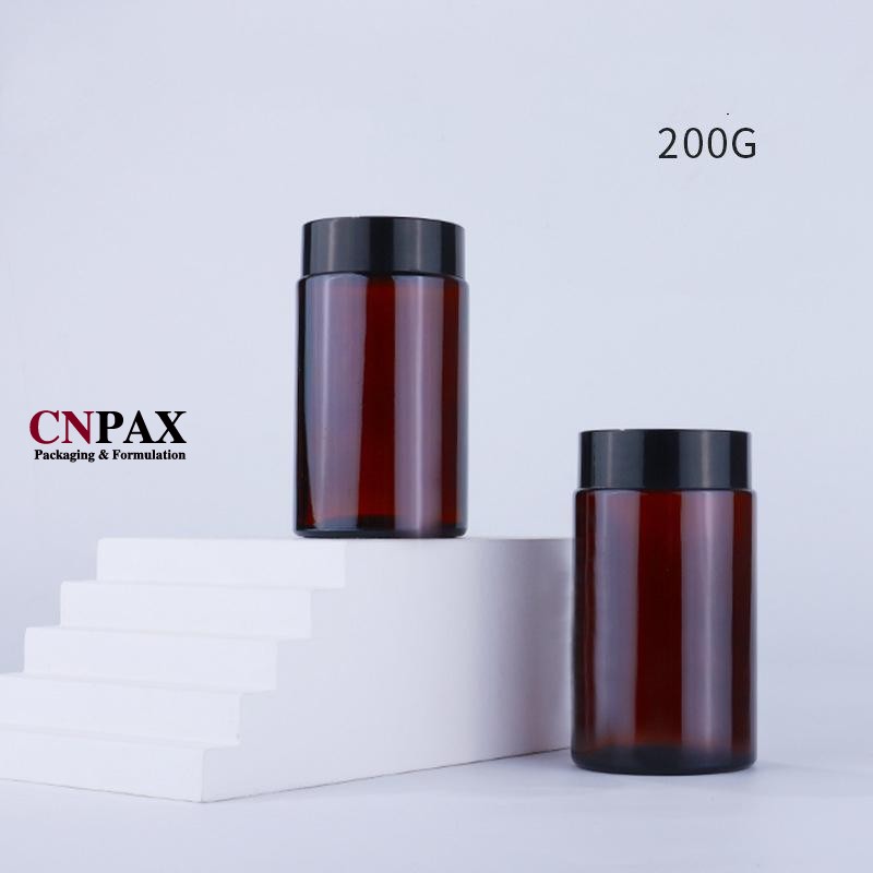 straight sided glass jar with black lid